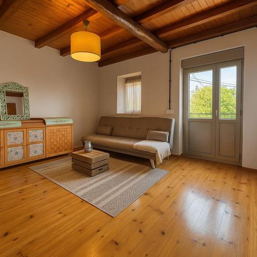 a living room with a couch and a table at Casa Milu in Armiello