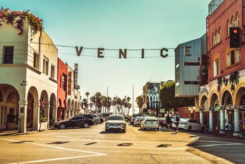 a city street with cars parked on the street at Fruit Hostel in Los Angeles