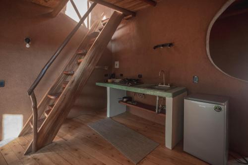 a kitchen with a sink and a staircase in a room at Casa Iteri in Lo de Marcos