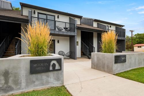 a house with two concrete planters in front of it at Near Downtown Stylish 2BR With Amazing Patio - #2 in Moab