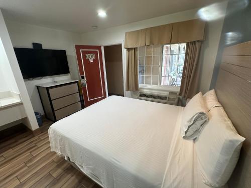 Letto o letti in una camera di Town and Country Inn