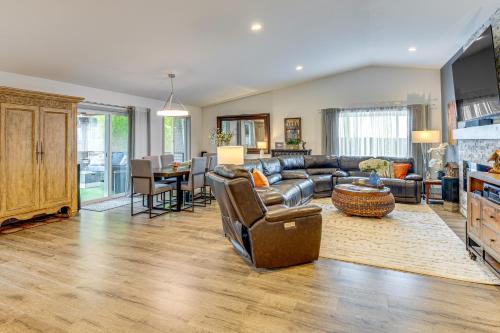 a living room with a couch and a table at Amazing Outdoor Space! Everett Escape with Hot Tub in Murphys Corner