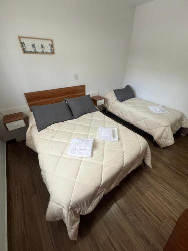 a bedroom with two beds in a room at Departamento Balcarce in San Martín