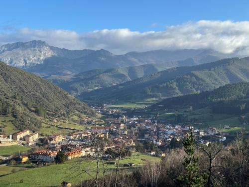 a small town in a valley in the mountains at Apartamento Valverde II in Potes