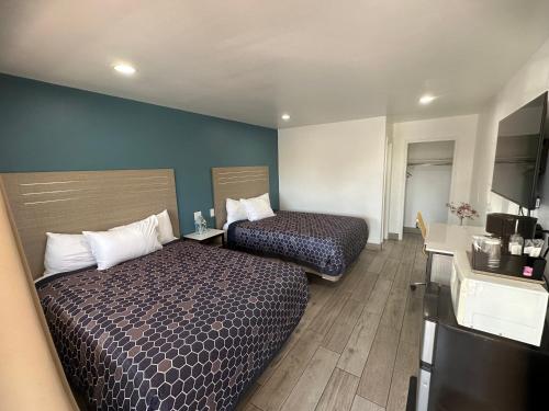 Letto o letti in una camera di Town and Country Inn