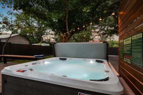 a bath tub sitting on top of a deck at Near Downtown Stylish 2BR With Amazing Patio - 4 in Moab