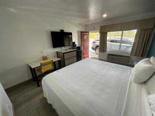 Letto o letti in una camera di Town and Country Inn