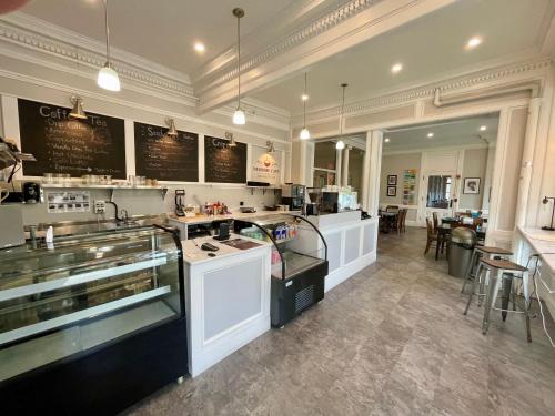 a large kitchen with a counter and a restaurant at The Brandon Inn in Brandon