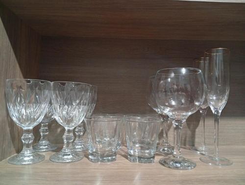 a group of wine glasses sitting on a table at Casa Na Vila Reno - Local Estratégico in Ponta Porã