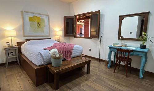 Ένα ή περισσότερα κρεβάτια σε δωμάτιο στο Hotel Siglo 17