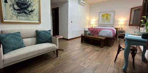 Ένα ή περισσότερα κρεβάτια σε δωμάτιο στο Hotel Siglo 17