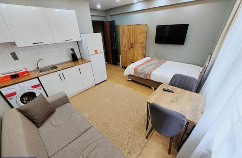 a living room with a couch and a bed at Sleepy Taksim Hotel in Istanbul