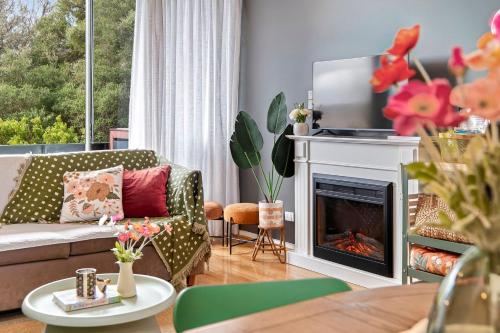 a living room with a couch and a fireplace at Fingal 1BR Sleeps 5 Apartment 28, Golf ,Beach, Hot Springs in Fingal