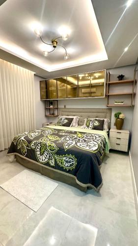 a bedroom with a large bed in a room at Luxury apartment in Umarizal in Belém