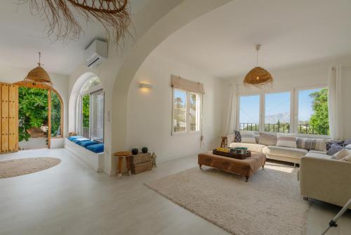 a living room with a couch and a table at Casa Cobalto, Sea view, Mediterranean, Sea 700meters, 4 Bedrooms in Benissa