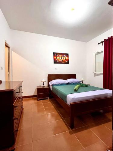 a bedroom with a bed in a room at Casa BB&Djassi - Apartment T1 in Ponta do Sol