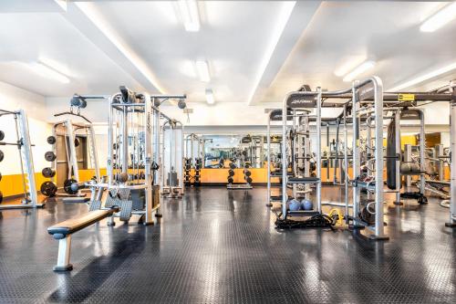 a gym with a lot of equipment in it at Superior 2 bedroom apartment in Heart of Hollywood in Los Angeles