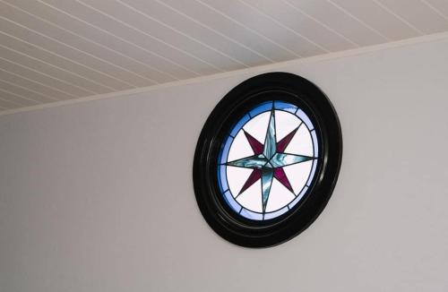 a round window on a wall in a room at Saltwood Peterborough in Peterborough