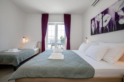 Apartments by the sea Banjol, Rab - 21635