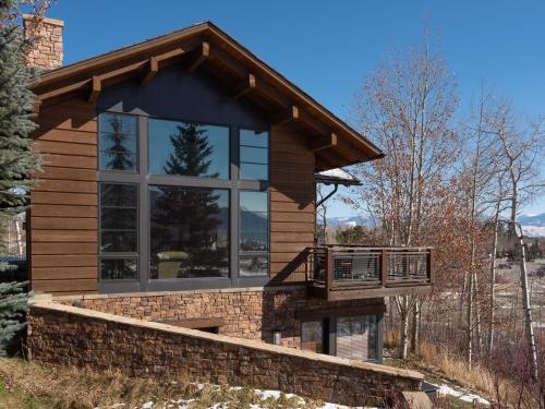 a house with a balcony on the side of it at RMR: Timbers at Granite Ridge 3098 in Teton Village in Teton Village