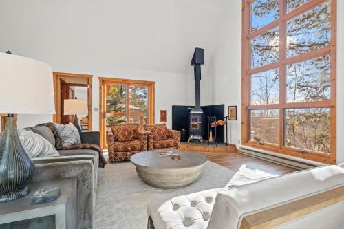 a living room with a couch and a table at RMR: Ringer House in Teton Village in Teton Village
