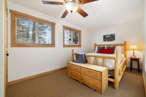 a bedroom with a bed and a ceiling fan at RMR: Three Bear Tracks Home in Teton Village in Teton Village