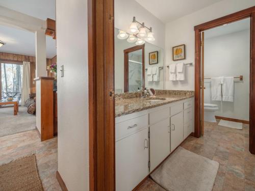 a bathroom with a sink and a mirror at RMR: Sagebrush 1311 Condo in The AspensWilsonWY in Wilson