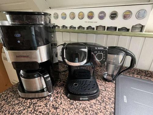 a coffee maker sitting on top of a counter at Sweden with sauna in Kleinweidelbach