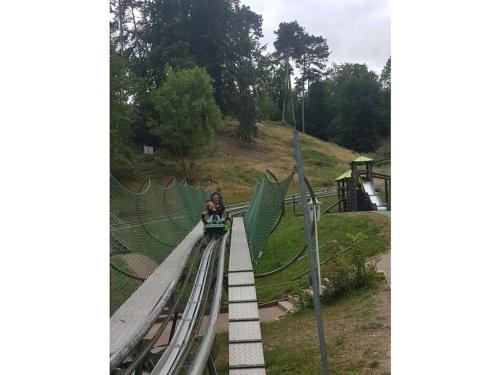 a woman riding a ride on a roller coaster at 2 bedroom cabin in Lütgenade
