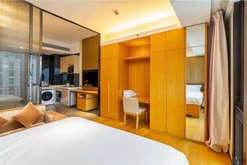 Ein Bett oder Betten in einem Zimmer der Unterkunft Yizhimei Light Residence