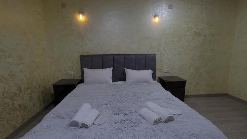 En eller flere senge i et værelse på Hotel Louis