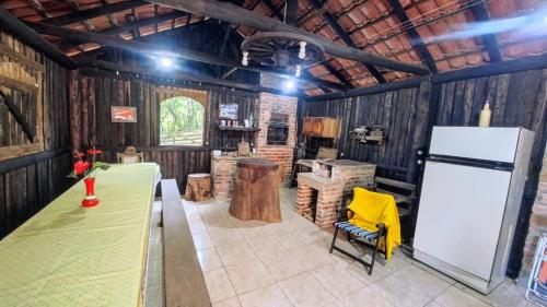 a large room with a bar in a barn at Sítio Canto do Monte in Rolante