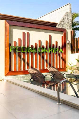 a sign on a building that says turf park at Pousada Pedra da Pipa in Pipa