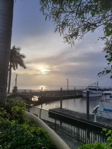 a dock with boats in a body of water at LakeOkechobeFishingfrm22DaylyfourprsMinPartyPerRoom in Pahokee