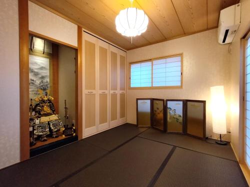 a hallway with a room with doors and a window at Nagoya Apricot House Entire Villa in Nagoya