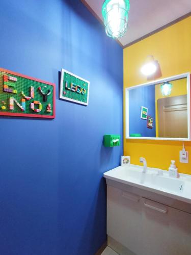 a bathroom with a sink and a mirror at Nagoya Apricot House Entire Villa in Nagoya