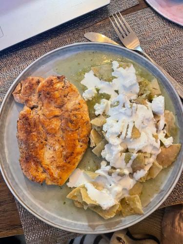 a plate of food with food on a table at Glampina in Huixquilucan