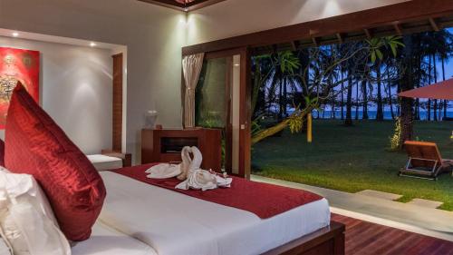 Ein Bett oder Betten in einem Zimmer der Unterkunft The Anandita by Elite Havens