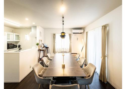a dining room and kitchen with a table and chairs at Passa Tempo Awajishima Ocean - Vacation STAY 22851v in Awaji