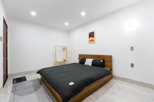 Postel nebo postele na pokoji v ubytování Nắng Homestay Đà Nẵng