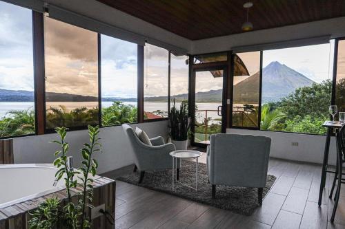 a bathroom with a tub and a view of a mountain at Volcano & Lake View Oasis with Scenic Tub in El Castillo de La Fortuna