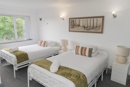 Ένα ή περισσότερα κρεβάτια σε δωμάτιο στο Family home, Convenient to Local Pubs, Takeaways