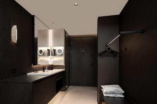 a bathroom with a sink and a mirror at Atour Hotel Shanghai The Bund Yuyuan Subway Station in Shanghai