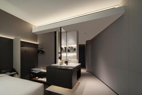 a bathroom with a sink and a mirror at Atour Hotel Shanghai The Bund Yuyuan Subway Station in Shanghai