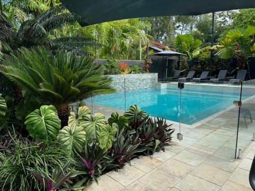 a swimming pool in a resort with plants at 25 Solander Boulevard - Seashells, Port Douglas in Port Douglas