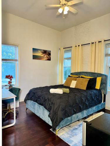 a bedroom with a bed and a ceiling fan at BP STAYS - Hotel-Style, No Host, Professionally Managed ID302 in Jersey City