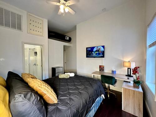 a bedroom with a bed and a desk in it at BP STAYS - Hotel-Style, No Host, Professionally Managed ID302 in Jersey City
