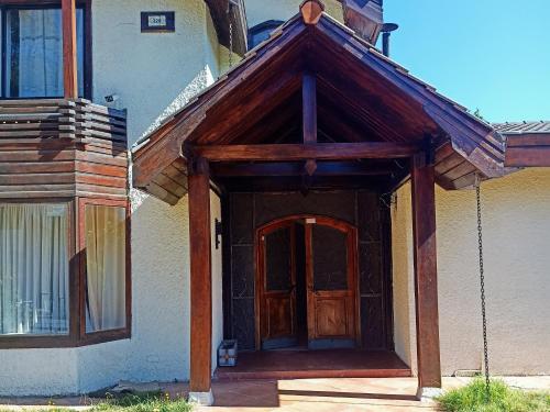 an entrance to a house with a wooden door at Hostal Antonio Varas in Concepción