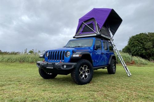 a blue jeep with a tent on top of it at Island Getaway Camper Cozy Rooftop Tent & Full Gear Kauai in Anahola
