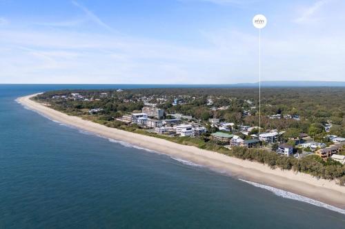 an aerial view of a beach with condos at Casa al mare - Bribie Island 5BD Retreat in Woorim